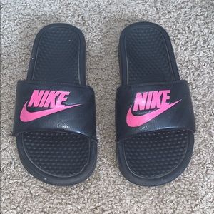 Very worn Nike slides